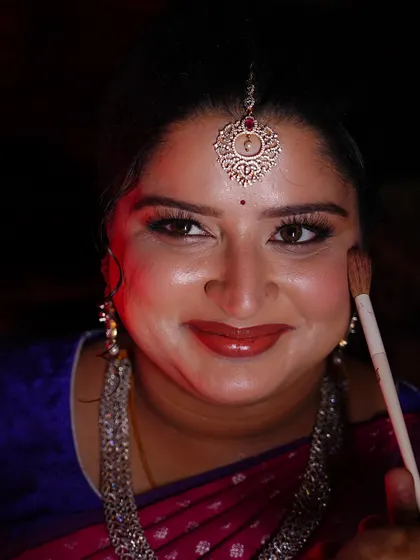 A happy smile during the final touches. It's so important to me that my clients enjoy the process of getting ready.
