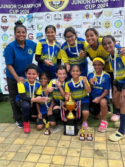 The full U12 Girls squad celebrating their first tournament victory. A journey of growth and friendship.