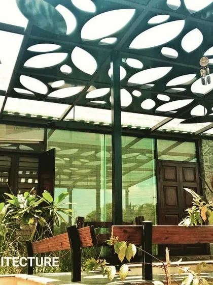 This pergola at our Cloverfield project features a custom-designed, laser-cut roof. The pattern creates playful shadows on the ground below, offering a semi-shaded outdoor space that is both functional and artistic.
