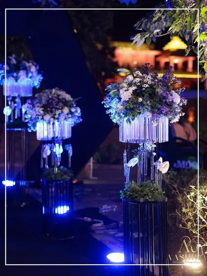 A collage showcasing the modern floral stands, where blooms were arranged in crystal-like structures and uplit with blue LEDs.