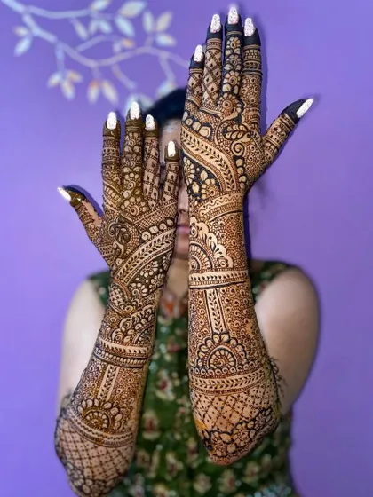 A stunning Arabic fusion design with bold, leafy patterns that flow beautifully up the arms.