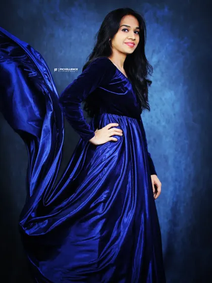 Another shot of the royal blue gown with its trail in motion, perfect for creating dynamic and captivating photos.