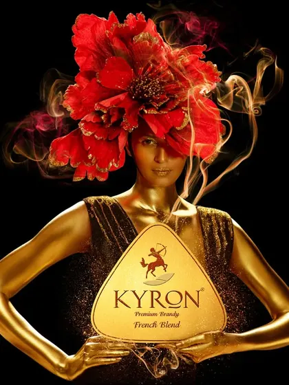 Another conceptual shot for Kyron Brandy. Here, the golden figure is adorned with a vibrant red floral headpiece and smoke, adding a layer of drama and mystique to the brand's visual identity.