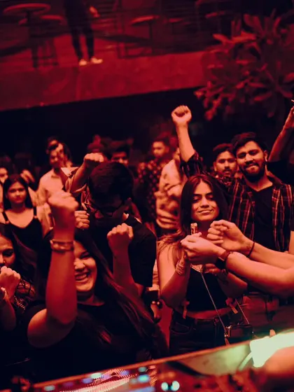 Warehouse vibes at Xora, Hyderabad. The crowd with their fists in the air, united by the beat.