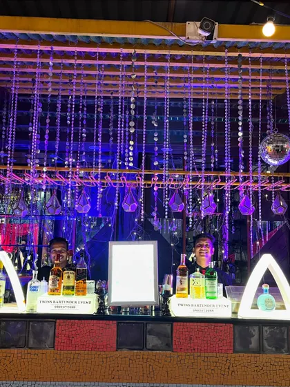 Our team behind a dazzling, fully-lit bar at a night cocktail affair in Vile Parle. This setup, with its hanging crystals and disco ball, created a glamorous, high-energy vibe.
