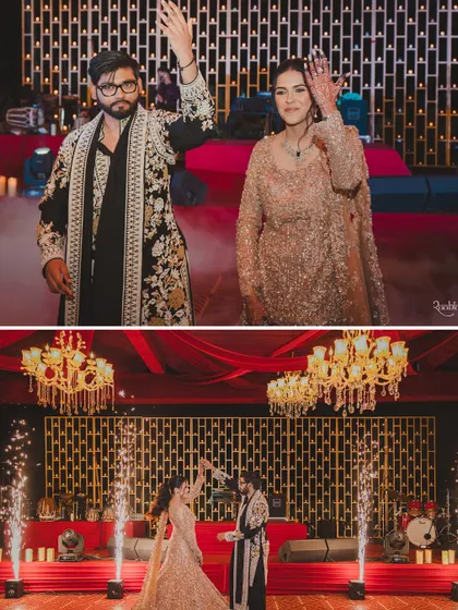 The couple's grand entrance and first dance on a stage lit with candles and sparklers.