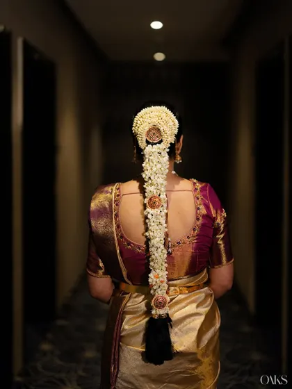 A stunning view of the traditional floral braid, a key element of the South Indian bridal look that I help coordinate.