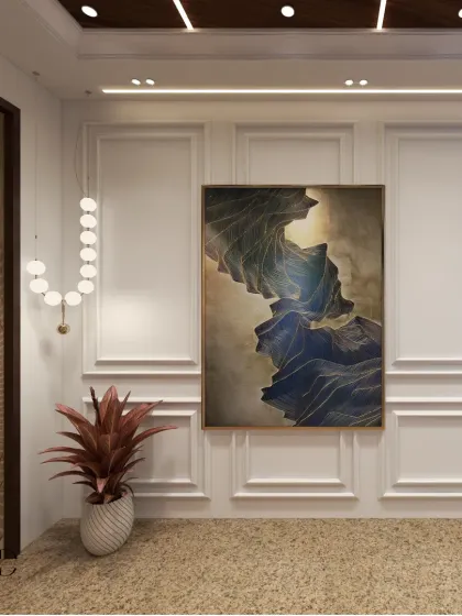 A statement painting framed by classic wall moldings adds a touch of color and sophistication to the grand entryway.