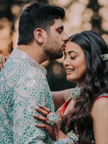 A tender moment between the couple during their Haldi photoshoot. The love and affection are beautifully captured.