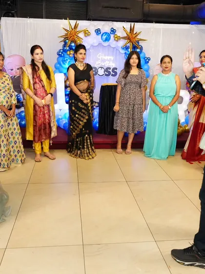 Addressing a group of ladies before starting a new party game.