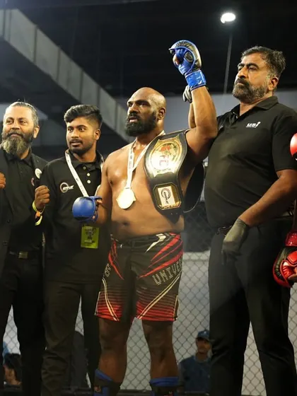 The moment of victory. Having my hand raised with the championship belt is a testament to the power of discipline and never giving up on your goals.
