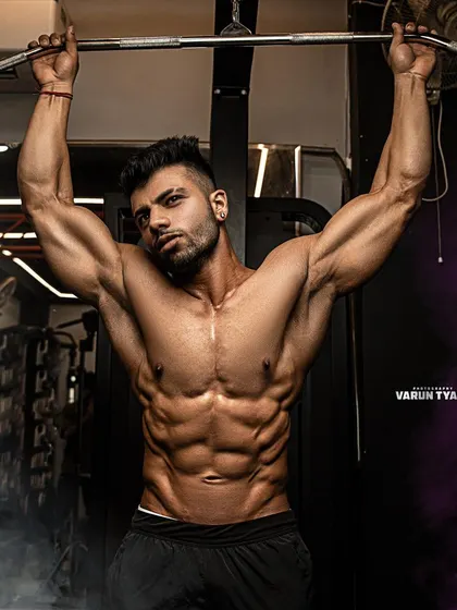 Titanium. This front pose from a photoshoot shows the abdominal and chest definition that I maintain.