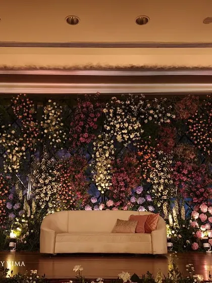 For this reception, we created a breathtaking backdrop with a wall of lavender and pastel florals. The strategic arrangement of hydrangeas, roses, and baby's breath created a magical and enchanting photo wall.