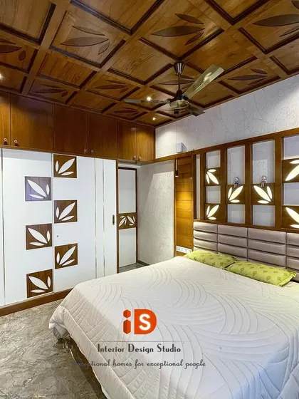 A full view of the traditional master bedroom, showing how the wooden ceiling, custom headboard, and matching wardrobe create a cohesive and richly detailed interior.