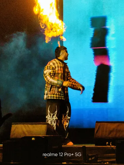 Capturing a dramatic moment on stage at Lollapalooza, as a performer breathes fire. The zoom lens of the phone allowed me to get a tight shot of the action from a distance.
