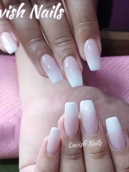 A classic ombré manicure on square-shaped nails, showing the smooth gradient that this popular style is known for.