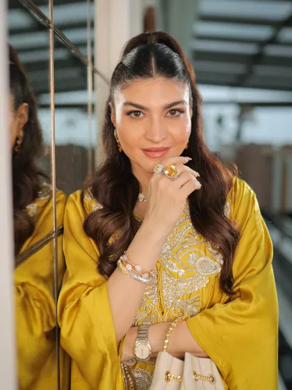 A close-up portrait showing her radiant skin and chic makeup. This look is effortlessly glamorous and perfect for any special occasion.