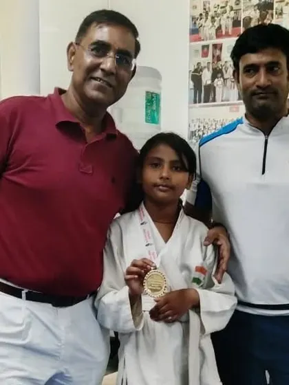 Posing with gold medalist Priya Das. Her victory is a victory for our entire academy.