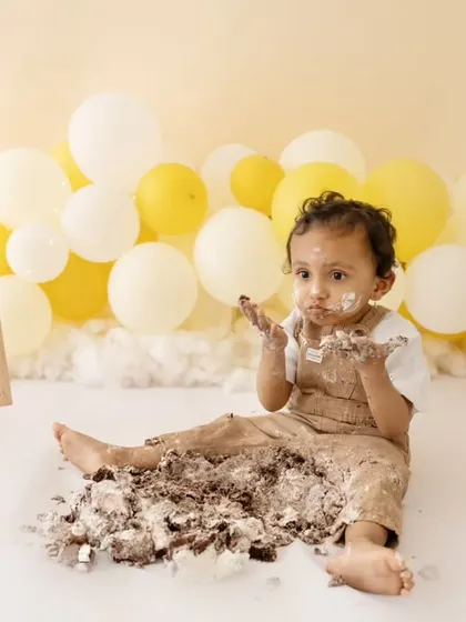 Covered in cake and happy as can be! A cake smash session is all about letting go and having fun, and I'm here to capture every messy moment.