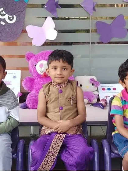 A group of boys dressed in purple and other colors for our Purple Day celebration.