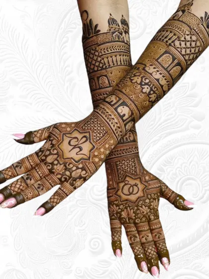 This full-arm engagement mehendi shows how I can personalize your design. It includes the couple's initials, intertwined rings, and a beautiful mix of traditional motifs like elephants and architectural domes.