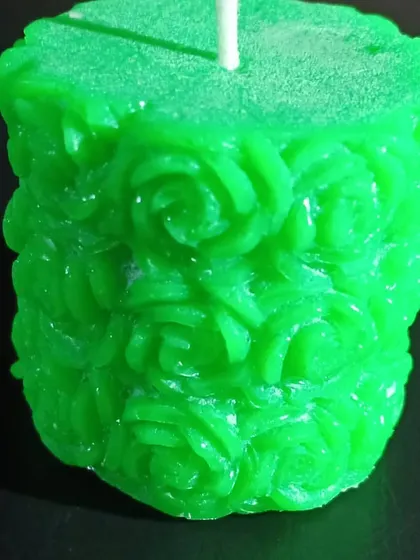 This image shows the texture and depth of the carvings on my green rose pillar candle. Each one is made by hand, so no two are exactly alike.