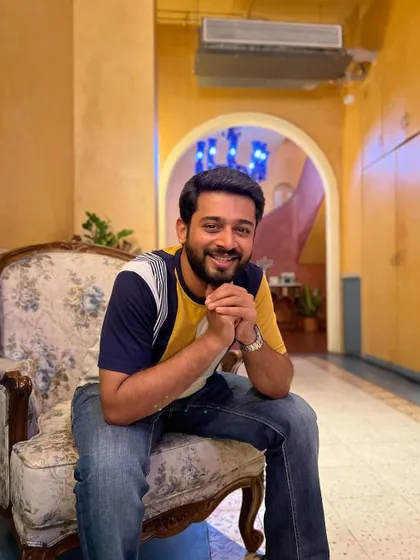 A happy, smiling shot from the same indoor location. This conveys warmth and personality, making a brand feel more approachable and friendly.