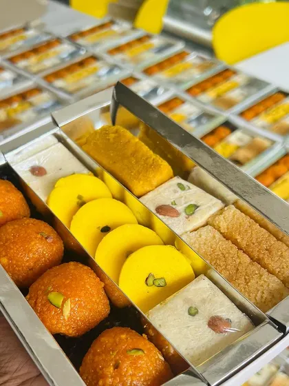 You have the freedom to create your own custom gift hampers. This silver box shows a popular combination of sweets chosen by a client, demonstrating how we can tailor each box to your specific preferences for any event.