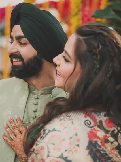 For this couple's Haldi and Mehendi function, we chose a stunning printed kaftan for the bride and a contrasting pistachio green kurta for the groom.