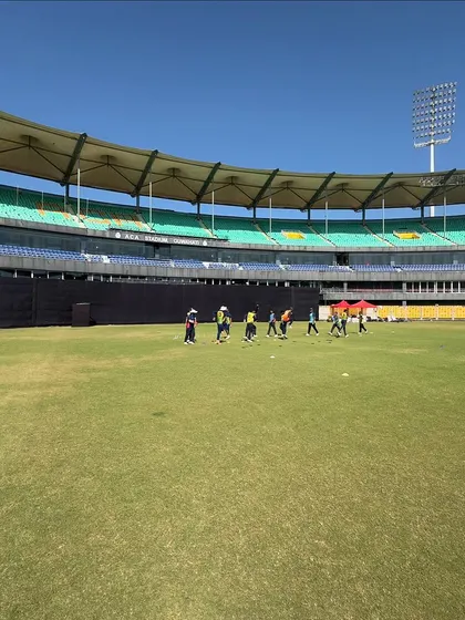 Players walking onto the field for a practice session. This is where the hard work begins.