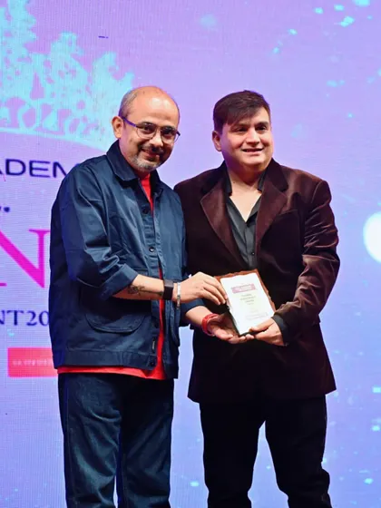 Sharing a smile while receiving the Global Achievers Award. These moments are a testament to the hard work and passion that goes into every project.