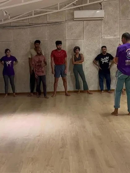 An instructor takes a moment to explain the next sequence. Clear, patient instruction is key to our teaching philosophy, ensuring everyone understands the technique and purpose of each move.