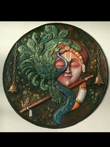 This is a finished and painted circular mural of Lord Krishna. The vibrant colors highlight the detailed 3D cement work underneath, creating a divine centerpiece that is both artistic and spiritual. This is an example of a finished indoor wall art piece.