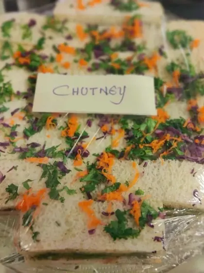 Our chutney sandwiches are a refreshing vegetarian choice. They are garnished with fresh herbs and vegetables, making them a light and flavorful snack.