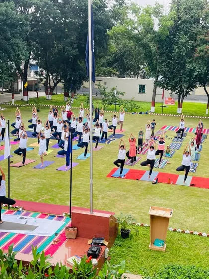 Leading the group through Vrikshasana, or Tree Pose. This balancing pose helps to cultivate focus and stability, and it's beautiful to see a whole field of people finding their balance together.