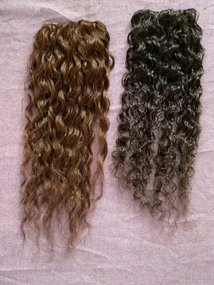 For my clients with curly hair, I have the perfect match. These two wefts show the beautiful, natural curl pattern of my 100% human hair extensions in different shades.