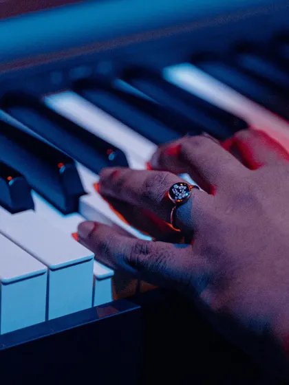 A close-up of my hands on the piano. Besides singing and guitar, I can also work out melodies and chord progressions on the keyboard.