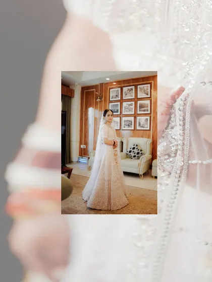 An artistic portrait of the bride, with a soft, dreamy overlay. This shot highlights her elegant pose and the beauty of her white wedding attire.