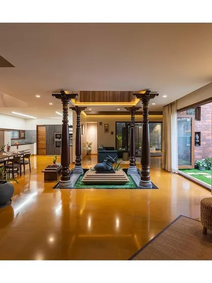 The central courtyard, with its Chettinad pillars and Nandi sculpture, acts as the peaceful, spiritual axis of the home.