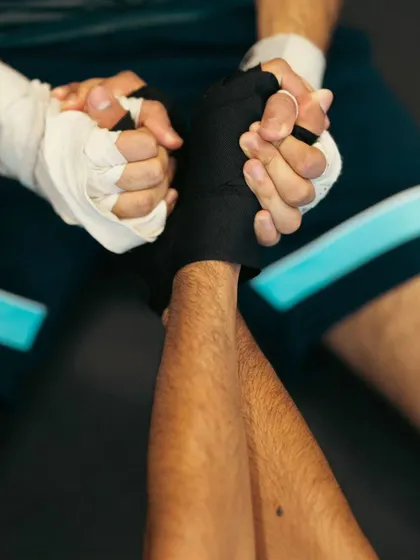 Wrapped hands ready for action. This image represents the preparation and mental focus that precedes every training session.