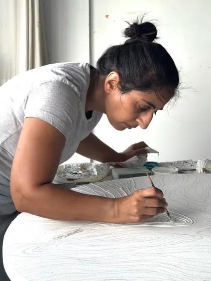 Leaning into the work, I feel a deep connection to the textures I'm creating. It's a very tactile and grounding experience, where every detail matters.