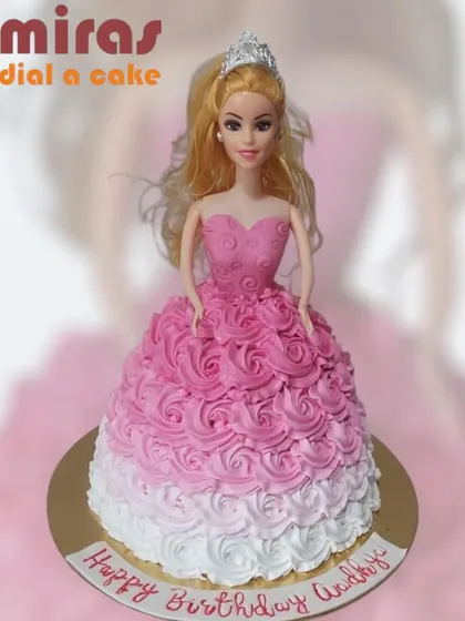 A classic Barbie doll cake, where the doll is dressed in a beautiful gown of pink and white rosette frosting. It's a timeless and elegant choice for a birthday queen.