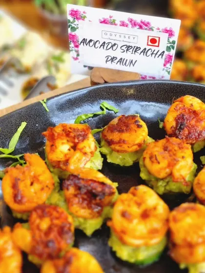 A labeled platter of our avocado sriracha prawns. Clear labeling helps guests easily identify dishes, which is an important part of our thoughtful service.
