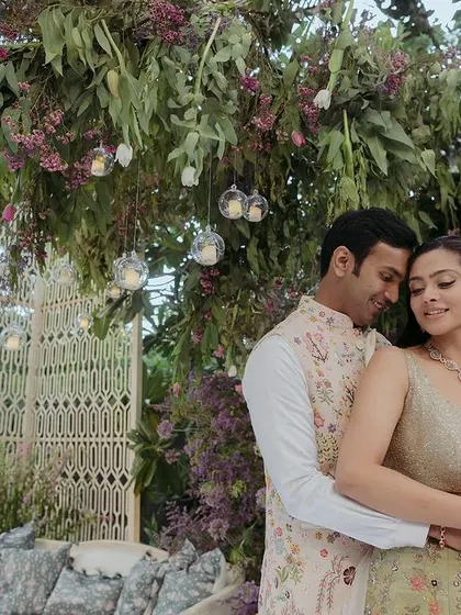 A romantic portrait from a Mehendi sundowner. We created a lush, dreamy setting with a custom floating island, macrame panels, and hanging floral installations for the couple to share a quiet moment.