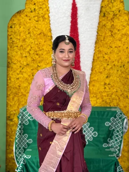 A close-up portrait of the client, her makeup looking soft and beautiful for the religious ceremony.