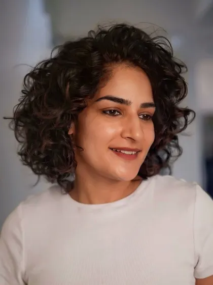 Too glam to give a damn. This short, curly haircut is full of personality and style, proving that short hair can be incredibly versatile.