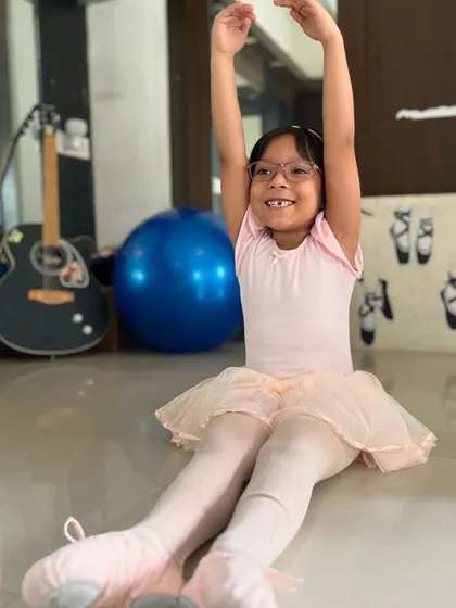 This young ballerina is all smiles as she practices her arm positions. I aim to create a positive and encouraging atmosphere in all my kids' classes.