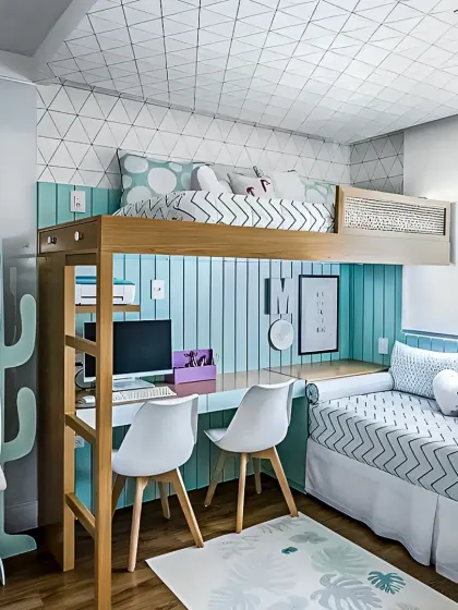 This loft bed design is perfect for a teen's room, with a full-size desk and workspace integrated underneath. The cheerful teal accent wall and geometric wallpaper create a fun and inspiring environment for study and rest.
