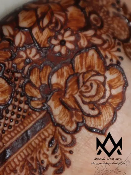 A macro shot of the rose detail in this non-bridal design, highlighting the fine linework.