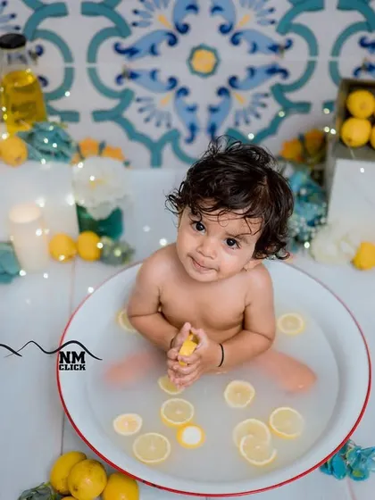 A sweet moment of calm during a fun lemon splash session. We capture a variety of expressions, from wild splashes to quiet curiosity.